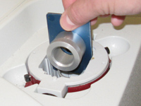 Placing a sample holder in the sample compartment of the IR100
