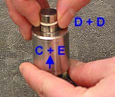 5b. 3)	Carefully transfer the sandwich of the two pellets D so that they rest on top of E.